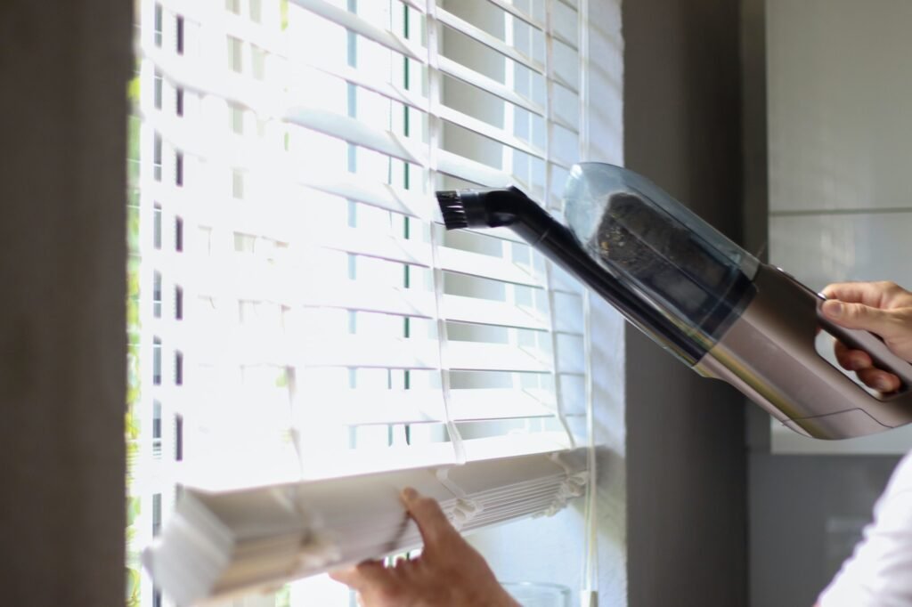 Vacuumed window blinds. Cleaning, organizing, homework.